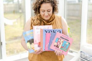 psychotherapist holding mental health books during a branding session