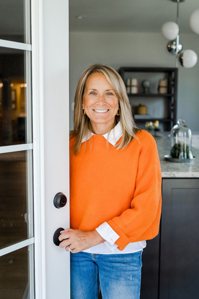 realtor branding session with a woman wearing an orange sweater