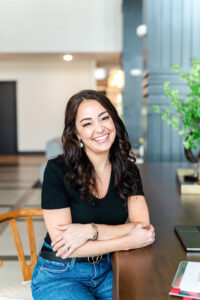 woman in black shirt smiling during a branding session for a realtor
