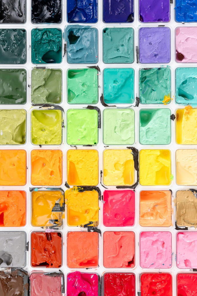 close up image of paint palette with many different colors