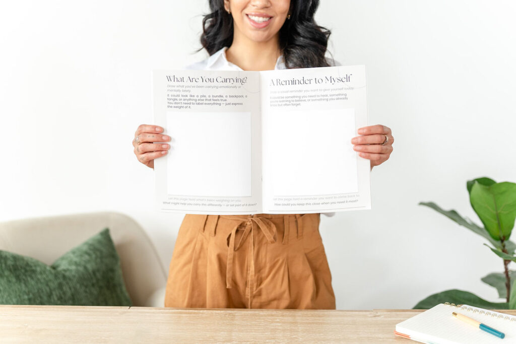 art therapist holding a therapy book during a branding session