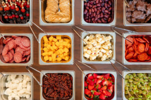 photo of containers with different charcuterie selections